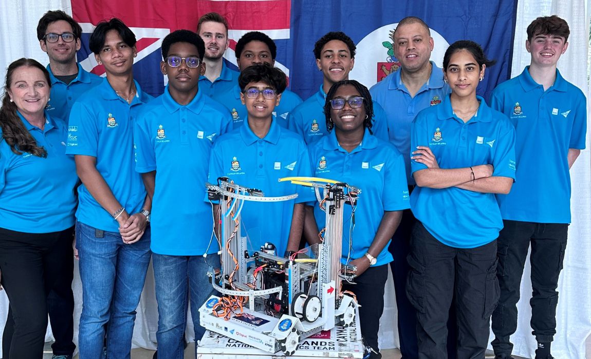 Minister Andre Ebanks with the 2024 National Robotics Team