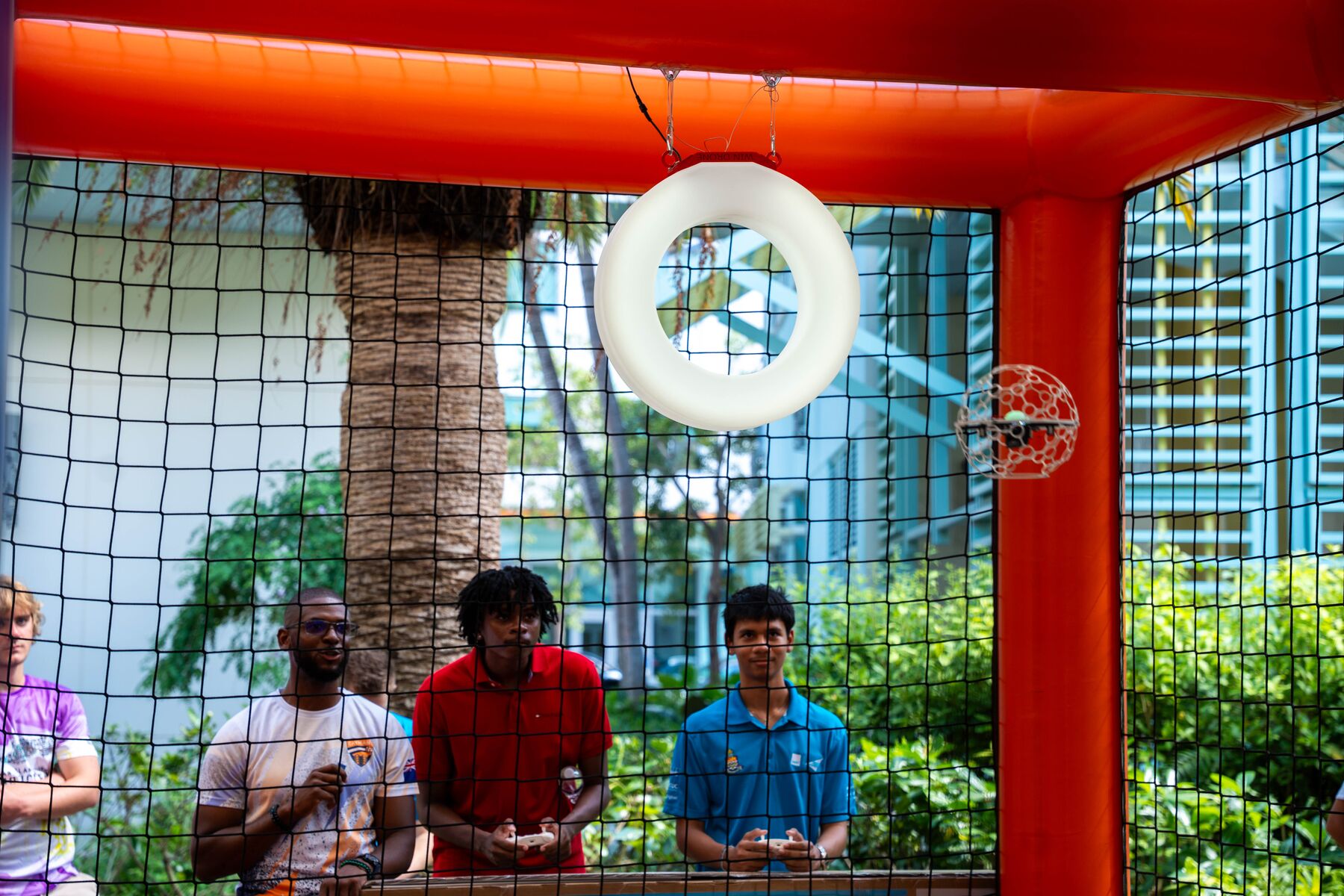 Members of the public try their hand at drone soccer during the first Drone soccer event. 